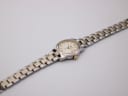 Overhead view of the Tissot PR 50 watch with the two-tone bracelet fully extended on a white background.