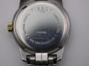 Detailed close-up of the stainless steel case back of the Tissot PR 50, displaying engravings for Tissot, 1853, Stainless Steel, Sapphire Crystal, Waterresistant 50M, and the serial number 189660 S.