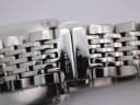 Macro view of the stainless steel bracelet's hidden butterfly clasp, signed "DREYFUSS & CO." with logo and showing light wear.