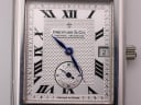 Macro shot of the Dreyfuss & Co. silver dial, highlighting the blued hands, date window, small seconds, and guilloche texture.