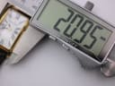 Digital caliper measuring the case width of the watch at 20.95mm.