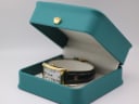 Maurice Lacroix watch displayed in a green leatherette presentation box (studio prop).