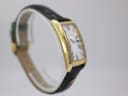 Reverse angled side view of the Maurice Lacroix watch, highlighting the case profile and green strap.