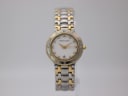 Front view of Maurice Lacroix 75416 two-tone watch with cream diamond dial on a clear stand.
