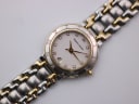 Close-up overhead shot of the Maurice Lacroix cream dial with eight diamond hour markers and a date window.