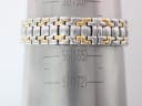 Two-tone steel bracelet measured on a wrist sizing gauge, indicating an approximate wrist circumference of 165mm.