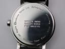 Detailed close-up of the polished stainless steel case back, showing engravings "OFFICIAL SWISS RAILWAYS WATCH", "Stainless Steel Case", and "Water Resistant".