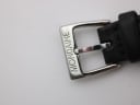 Close-up of the watch's silver buckle, clearly engraved with the "MONDANE" brand name.