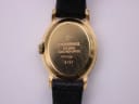Detailed close-up of the Raymond Weil 5717 case back engraving, showing 'RAYMOND WEIL', '18K GOLD ELECTROPLATED', '10M', and model number '5717'.