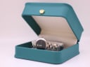 The Movado watch displayed within a green leatherette studio presentation box.