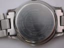 Close-up of the stainless steel case back, revealing "Movado Since 1881", "Water-Resistant", "Quartz", "All Steel" and model number engravings.