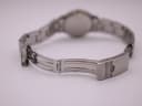 View of the Movado watch's stainless steel deployant clasp in an open position.