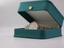 Tissot Seastar watch displayed in a generic green leatherette presentation box with a gold crown emblem.