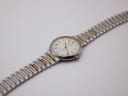 Full length, slightly angled top-down view of the Tissot Seastar watch and bracelet.