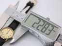 Digital caliper measuring the Zenith watch case diameter, displaying 22.83mm.