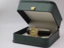 Zenith watch resting in a green leatherette display box, a studio prop used for photography.