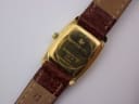 Close-up of the gold-plated case back of the Raymond Weil 5744, engraved with "RAYMOND WEIL", "PLAQUE OR G 10 M", "5744", and "WATERRESISTANT".