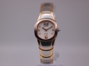 Front view of two-tone Seiko Vivace watch with oval case and white dial.
