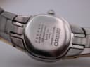 Close-up of the polished stainless steel case back with Seiko engravings.