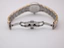 View of the open butterfly deployment clasp of the two-tone Seiko bracelet.