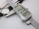 Digital caliper measuring the case diameter of the XEN watch, displaying 27.16mm.