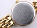 Close-up of the watch case back showing "STAINLESS STEEL BACK", "WATER RESISTANT 3ATM", model 5892, serial D14939, and "SWISS MADE" engravings.