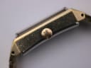 Detailed close-up of the textured gold-plated crown of the Seiko manual wind watch.