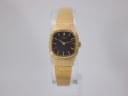 Front view of the gold tone Seiko ladies' quartz watch with black rectangular dial and integrated mesh bracelet.