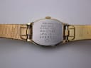 Reverse view of the Seiko watch, showing the stainless steel case back with model and serial numbers engraved.