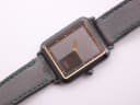 Overhead angled view of the Seiko watch on its black leather strap, showing the dial details and strap condition.