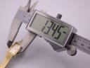 Digital caliper measuring the watch case width, showing a precise measurement of 17.45mm.