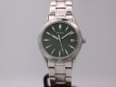 Front view of Seiko V742-8080 watch with deep green dial, baton indices, and stainless steel bracelet.