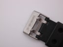 Close-up of the G-Shock signed stainless steel buckle on the black resin strap.