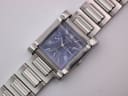 Angled close-up of the Seiko GLX rectangular watch with blue dial, Roman numerals, and steel bracelet, on a white background.