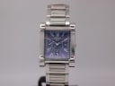 Front view of the Seiko GLX watch, showcasing its rectangular blue dial with sub-dials and integrated steel bracelet.