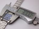 Digital caliper measuring the width of the Seiko GLX watch case, displaying 30.00mm.