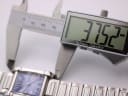 Digital caliper measuring the length of the Seiko GLX watch case (lug-to-lug), displaying 37.52mm.