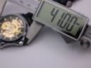 Digital caliper displaying a precise measurement of the watch case diameter at 41.00mm.
