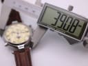 Close-up of a digital caliper measuring the watch case diameter, displaying 39.08mm.