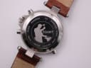 Close-up of the stainless steel case back, featuring the "Stauer" logo with a blacksmith and engravings for water resistance (5 ATM) and serial number DS 13372.