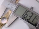 Digital caliper measuring the case diameter of the Citizen watch, displaying an exact measurement of 16.3mm.