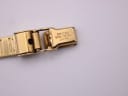 Close-up of the gold tone folding clasp, clearly engraved with 'CITIZEN BASE METAL JAPAN'.
