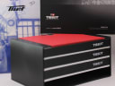 Original Tissot documentation including a black sleeve and the red original watch box components.