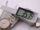 Digital caliper measuring the Tissot Ballade watch case diameter at 35.79mm.