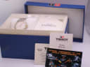 Tissot Ballade watch in its original blue presentation box, with accompanying papers and warranty card.