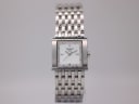 Front view of Tissot L910 ladies watch with square stainless steel case, white mother-of-pearl dial, and integrated steel bracelet.