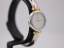 Another angled side view of the Michel Herbelin watch, showcasing the elegant round case and integrated bangle bracelet.