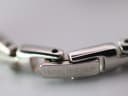 Detailed close-up of the polished fold-over clasp on the bracelet, clearly showing the 'Michel Herbelin' engraving.