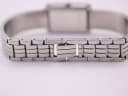 Close-up of the Michel Herbelin integrated steel bracelet and signed fold-over clasp 'HERBELIN'.