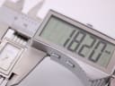 Digital caliper measuring the Michel Herbelin watch case diameter at 18.20mm.